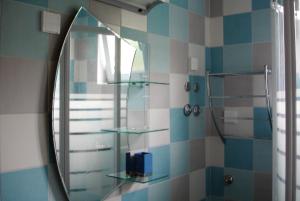 a bathroom with a mirror and a shower at Apartments with parking space Banjol, Rab - 4956 in Rab +24 photos