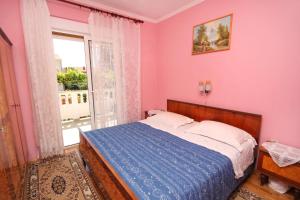 Postel nebo postele na pokoji v ubytování Apartments and rooms with parking space Palit, Rab - 5061