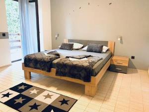 a bedroom with a bed in a room at Apartments and rooms by the sea Starigrad, Paklenica - 6591 in Starigrad