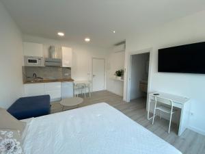 Η κουζίνα ή μικρή κουζίνα στο Camiño da Praia +11 φωτογραφίες