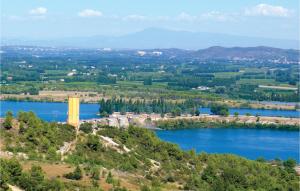 an aerial view of a lake and a water tower at Stunning Home In Vallabrgues With Kitchen in Vallabrègues