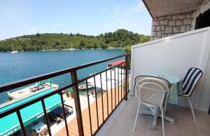 a balcony with a view of a body of water at Rooms by the sea Pomena, Mljet - 4929 in Pomena