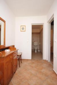 a bathroom with a vanity and a toilet in a room at Holiday house with a parking space Sali, Dugi otok - 8138 in Sali