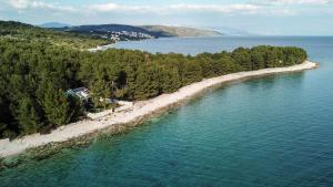 an aerial view of an island in a body of water at Secluded fisherman's cottage Cove Duga, Ciovo - 17349 in Okrug Gornji