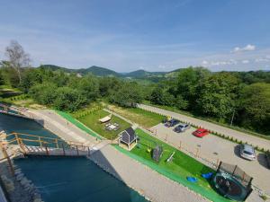 an aerial view of a marina with a tent next to the water at Jaworowe Wzgórze Solina in Solina