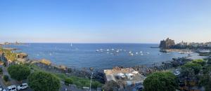 a view of a body of water with boats in it at Mareincasa in Aci Castello