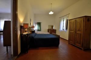 Postel nebo postele na pokoji v ubytování Agriturismo Poggio ai Grilli