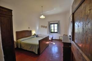 Postel nebo postele na pokoji v ubytování Agriturismo Poggio ai Grilli