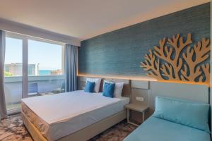 Postel nebo postele na pokoji v ubytování Bacolux Koralio, Eforie Nord