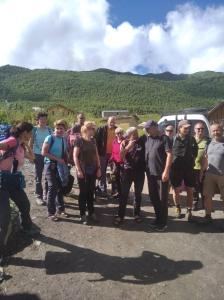 a group of people standing on the side of a road at Guest House Buba in Ushguli