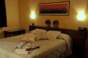 Кровать или кровати в номере Hotel Parco
