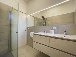 a bathroom with a sink and a shower at Villa Venezia Bardolino in Bardolino