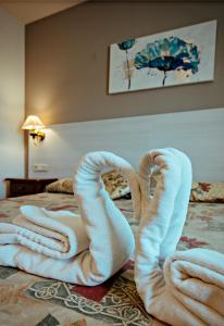 Postel nebo postele na pokoji v ubytování Hotel BONCOMPTE