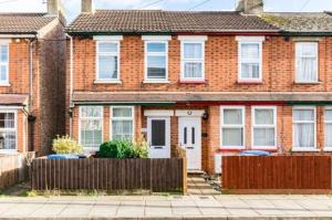 a brick house with a fence in front of it at * Ipswich Suffolk Contractor Holiday Short Stay * in Whitton