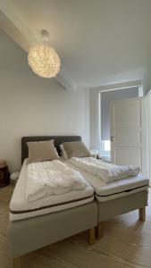 En eller flere senge i et værelse på ApartmentInCopenhagen Apartment 1506