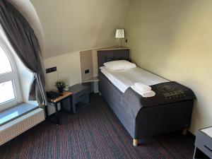 Postel nebo postele na pokoji v ubytování Braavo Spa Hotel