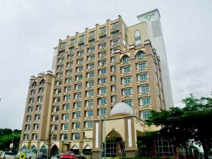 a largeiegelled building with a dome in front of it at Private Studio Viana Court Service Apartment 3 with private parking in Kota Bharu