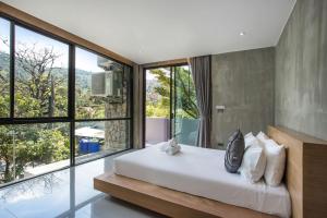 En eller flere senge i et værelse på Villa Jeanne + 27 billeder