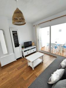 Televízia a/alebo spoločenská miestnosť v ubytovaní La Casita de Vera
