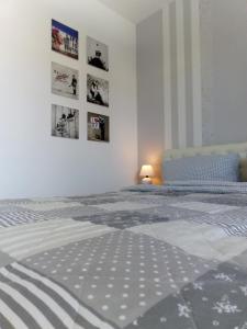 a bedroom with a bed with a striped wall at Villa Regina in Möhnesee