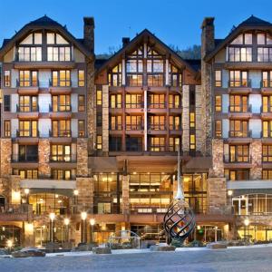 a large building with a lot of windows at Platinum Vail Solaris 1 Bedroom Vacation Rental Set At The Base Of The Mountain Just Steps From The Gondola in Vail