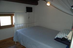 Ein Bett oder Betten in einem Zimmer der Unterkunft Casa Carolina