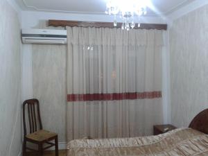 Un ou plusieurs lits dans un hébergement de l'établissement Baku Apartment