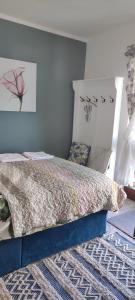 a bedroom with a bed in a room at Key Locker by WhatsApp , Joanna's Little Studio, Own entrance, Own Bathroom in Youghal