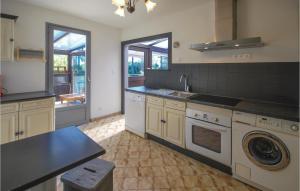 a large kitchen with a sink and a dishwasher at Beautiful Home In Signes in Signes