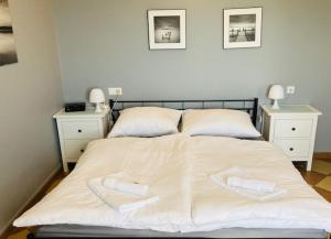 Säng eller sängar i ett rum på ANNABERG Polanica Zdrój