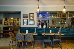 a restaurant with a long table and chairs at The Fox Inn in Guisborough