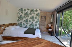Posteľ alebo postele v izbe v ubytovaní Charmant logis neuf équipé/Piscine/SPA/Sauna/Gym + 37 fotografií
