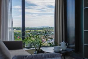 a hotel room with a view of the ocean at Arche Hotel Wrocław Airport in Wrocław