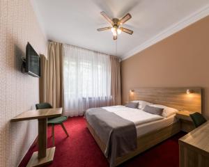 Postel nebo postele na pokoji v ubytování Hotel Meda of Museum Kampa + 8 fotografií