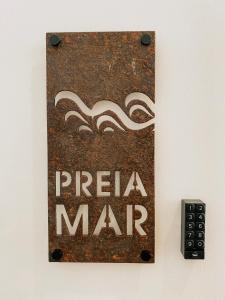 a sign on a wall that says pizza man at Preia-Mar Duplex Setúbal Miradouro in Setúbal