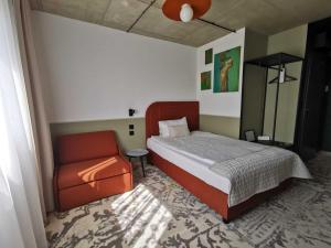 Postel nebo postele na pokoji v ubytování Arche Hotel Wrocław Airport