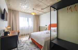 Postel nebo postele na pokoji v ubytování Arche Hotel Wrocław Airport