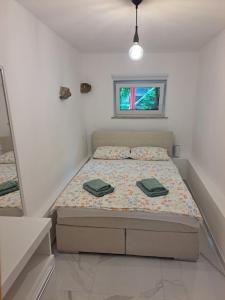 Postel nebo postele na pokoji v ubytování Apartma ŠPANO