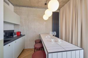 Kuchyň nebo kuchyňský kout v ubytování Arche Hotel Wrocław Airport