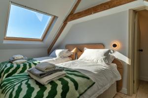 a bedroom with two beds and a window at Finest Retreats - The Half-ARC of Padstow in St. Issey