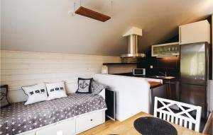 a kitchen with a bench with pillows on it at Beautiful Home In Henn With Kitchen in Henån