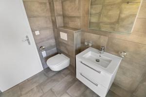 Koupelna v ubytování Superbe appartement neuf et cosy + 18 fotografií