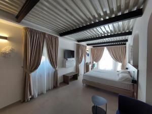 Postel nebo postele na pokoji v ubytování Boutique Hotel Palazzo Donna Iulia