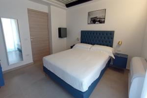 Postel nebo postele na pokoji v ubytování Boutique Hotel Palazzo Donna Iulia