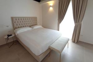 Postel nebo postele na pokoji v ubytování Boutique Hotel Palazzo Donna Iulia