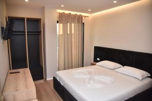 Postel nebo postele na pokoji v ubytování Hotel Continental
