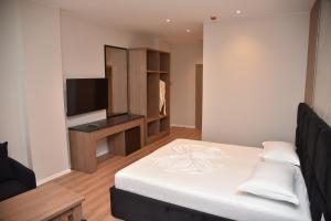 Postel nebo postele na pokoji v ubytování Hotel Continental