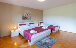 Postel nebo postele na pokoji v ubytování Holiday Home Rabac 13