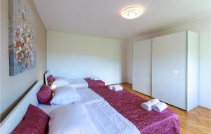 Postel nebo postele na pokoji v ubytování Holiday Home Rabac 13