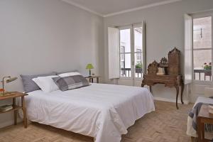 Ένα ή περισσότερα κρεβάτια σε δωμάτιο στο Casas do Arco